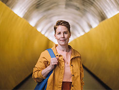 567928913-567928216-ey-portrait-of-confident-woman-with-bag-standing-at-subway-tunnel-245x185.jpg