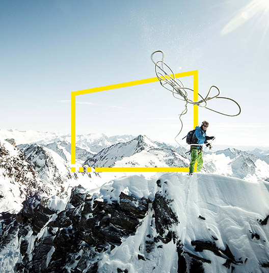 ey-climber-throwing-his-rope-to-assist-his-climbing-partner-in-the-austrian-alps