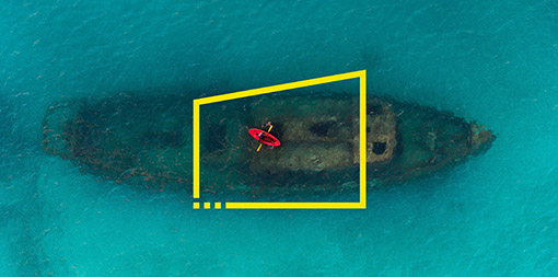 ey-red-kayak-floating-above-a-shipwreck-carlisle-bay-barbados
