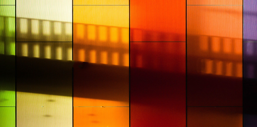 ey-shadow-of-a-straircase-on-a-rainbow-striped-wall